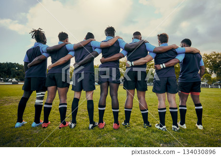 Back view, men or rugby team in stadium with support, unity or pride ready for a sports game together. Fitness, solidarity or proud players in line for match, workout or exercise on training field 134030896