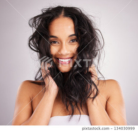 Hair care, woman and beauty with portrait, cosmetics and happy with messy hairstyle on studio background. Wellness, shine and female smile, face and treatment, keratin and texture with volume 134030999