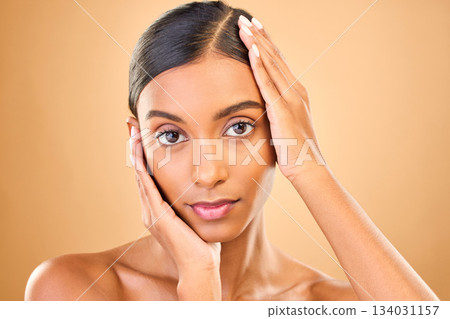 Skincare, face portrait and beauty of woman in studio isolated on brown background. Natural makeup, cosmetics and confident Indian female model with spa facial treatment for healthy or flawless skin. 134031157