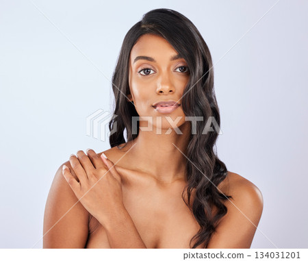 Indian girl, hair care or face in studio portrait for beauty, healthy natural shine or wellness. Beautiful glowing woman model, salon or curly hairstyle cosmetics in grooming on white background Indian girl, hair care or face in studio portrait for beauty, healthy natural shine or wellness. Beautiful glowing woman model, salon or curly hairstyle cosmetics in grooming on white background 134031201