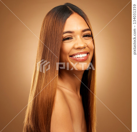 Hair care, beauty and smile of woman portrait in studio for growth and color shine or healthy texture. Aesthetic female happy for haircare, natural makeup and hairdresser or salon brown background 134031359