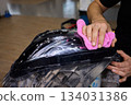 Applying a Protective Film on the Surface of Your Car for Enhanced Durability and Shine 134031386