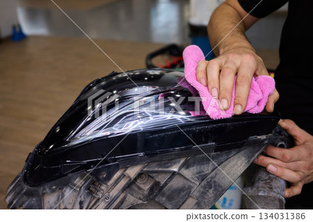 Applying a Protective Film on the Surface of Your Car for Enhanced Durability and Shine Applying a Protective Film on the Surface of Your Car for Enhanced Durability and Shine 134031386