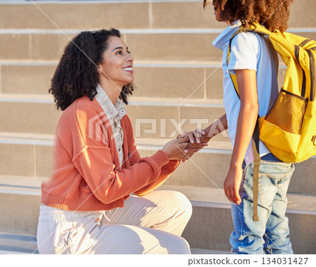 Mother, child and back to school for education, learning or childhood development at the academy. Mom, kid and holding hands with smile saying goodbye to son by steps ready to learn with backpack 134031427