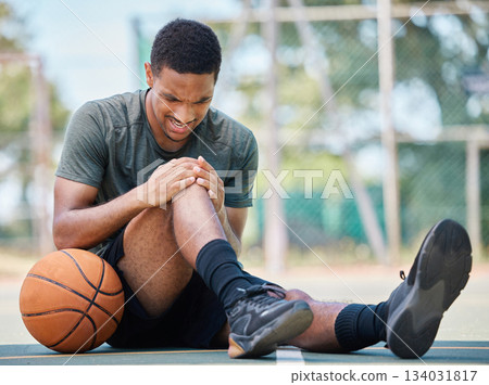 Basketball court, man and injury, knee pain and joint pain, fitness emergency and first aid accident, risk and bone health. Black man, basketball player and leg pain, muscle inflammation and problem 134031817