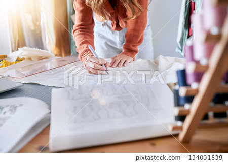 Fashion, designer and pattern with woman and fabric for planning, manufacturing and creative with clothes. Textile, workshop and retail with hands of girl in studio for boutique, tailor and sewing Fashion, designer and pattern with woman and fabric for planning, manufacturing and creative with clothes. Textile, workshop and retail with hands of girl in studio for boutique, tailor and sewing 134031839