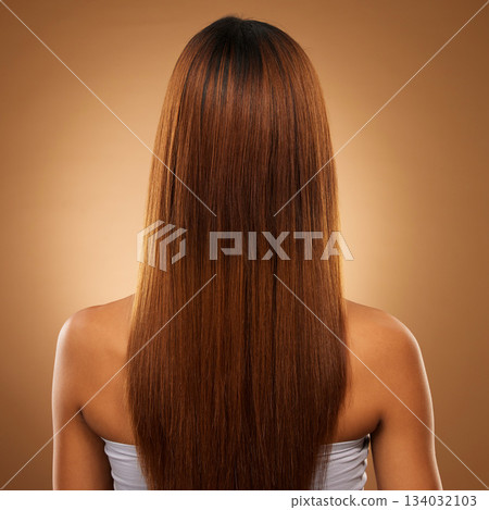 Back of hair, beauty and woman in studio for shampoo, wellness and keratin treatment on brown background. Hairdresser mockup, salon and girl with hairstyle for growth, haircare texture and cosmetics Back of hair, beauty and woman in studio for shampoo, wellness and keratin treatment on brown background. Hairdresser mockup, salon and girl with hairstyle for growth, haircare texture and cosmetics 134032103