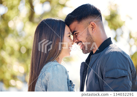 Happy couple, outdoor and smile for love, care and happiness together in summer. Head of young man and woman at nature park for affection or laughing on a romantic date, holiday or vacation to relax 134032291