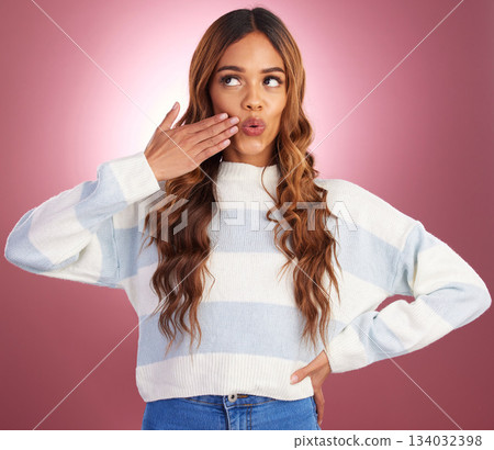 Thinking, hand gesture and funny face with a woman on a pink background in studio feeling silly or goofy. Idea, comedy and comic with an attractive young female having fun or joking about humor Thinking, hand gesture and funny face with a woman on a pink background in studio feeling silly or goofy. Idea, comedy and comic with an attractive young female having fun or joking about humor 134032398