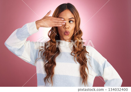 Funny face, hand gesture and comedy with a woman in studio on a pink background for fun or humor. Eye, comic and crazy with an attractive young female feeling silly, goofy or playful while joking Funny face, hand gesture and comedy with a woman in studio on a pink background for fun or humor. Eye, comic and crazy with an attractive young female feeling silly, goofy or playful while joking 134032400