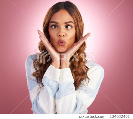 Silly, goofy and young woman in a studio with a funny, comic or crazy facial expression. Humor, joke and female model with a comedy face gesture as a joke isolated by a gradient purple background. Silly, goofy and young woman in a studio with a funny, comic or crazy facial expression. Humor, joke and female model with a comedy face gesture as a joke isolated by a gradient purple background. 134032401
