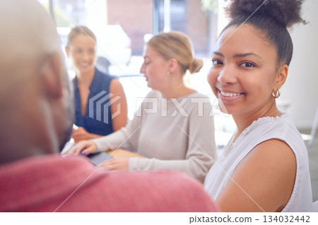 Office, meeting portrait and happy woman in business collaboration, teamwork or cooperation on strategy, research or planning. Smile, group and startup social media company working on development Office, meeting portrait and happy woman in business collaboration, teamwork or cooperation on strategy, research or planning. Smile, group and startup social media company working on development 134032442