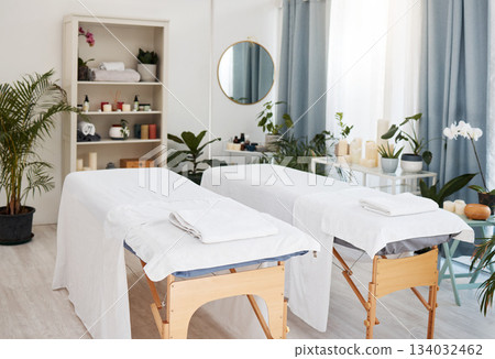 Spa, bed and wellness salon for treatment or luxury resort bed or vacation and relaxation room. Massage, zen and hospitality furniture or expensive therapy or stress relief place and white towels 134032462