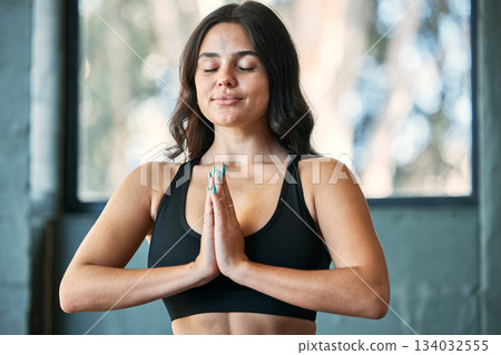 Yoga meditation, prayer hands and woman in home for health, wellness and exercise. Pilates, zen chakra and calm female yogi meditate with namaste for holistic training, peace and mindfulness workout. Yoga meditation, prayer hands and woman in home for health, wellness and exercise. Pilates, zen chakra and calm female yogi meditate with namaste for holistic training, peace and mindfulness workout. 134032555