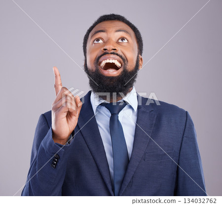 Wow, pointing and promotion with a business black man in studio on a gray background for motivation. Winner, hand gesture and announcement with a corporate male employee celebrating success 134032762