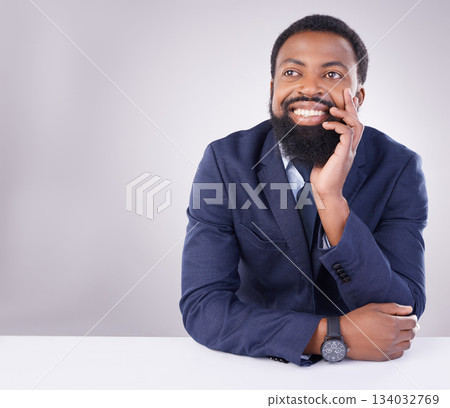 Happy, thinking and a black man sitting by a table isolated on a white background in a studio. Smile, thoughtful and an African businessman with an idea, thought or contemplation on a backdrop Happy, thinking and a black man sitting by a table isolated on a white background in a studio. Smile, thoughtful and an African businessman with an idea, thought or contemplation on a backdrop 134032769