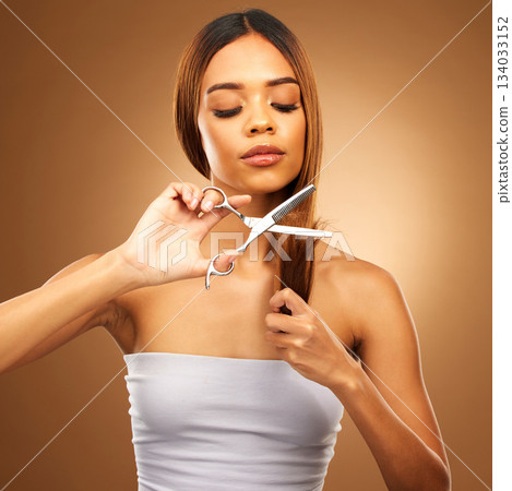 Haircut, woman with scissors and beauty, hair care and tools with serious person on brown background. Cosmetics shine, split ends treatment and keratin with cosmetology, female with makeup in studio Haircut, woman with scissors and beauty, hair care and tools with serious person on brown background. Cosmetics shine, split ends treatment and keratin with cosmetology, female with makeup in studio 134033152