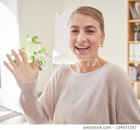 Wave, video call and portrait of woman in office for conference, communication and networking. Hello, greeting and online meeting with female in startup agency for virtual, friendly and webinar 134033167