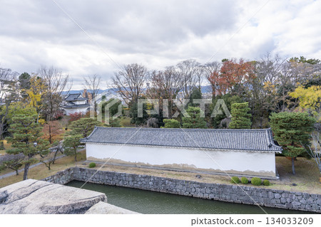 Nijo Castle in late autumn: The moat and southwest storehouse (rice storehouse) seen from the remains of the castle tower, Nakagyo Ward, Kyoto City Nijo Castle in late autumn: The moat and southwest storehouse (rice storehouse) seen from the remains of the castle tower, Nakagyo Ward, Kyoto City 134033209
