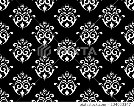 Wallpaper in the style of Baroque. White and black floral ornament. Seamless vector background. Graphic pattern for fabric, wallpaper, packaging. Ornate Damask flower illustration. 134033347