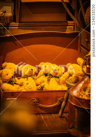 A warm scene with a teddy bear surrounded by Christmas goods A warm scene with a teddy bear surrounded by Christmas goods 134038550