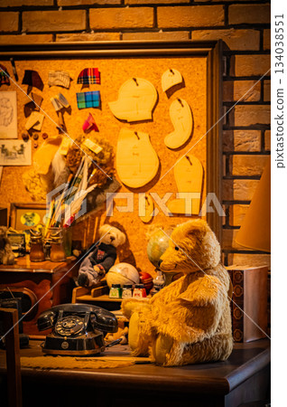 A warm scene with a teddy bear surrounded by Christmas goods 134038551
