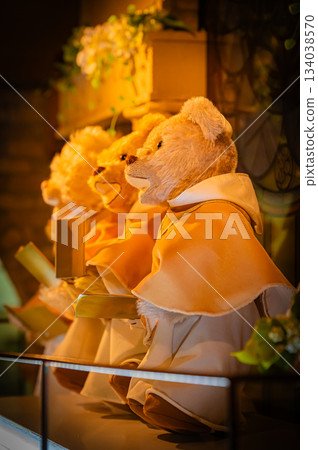 A warm scene with a teddy bear surrounded by Christmas goods A warm scene with a teddy bear surrounded by Christmas goods 134038570