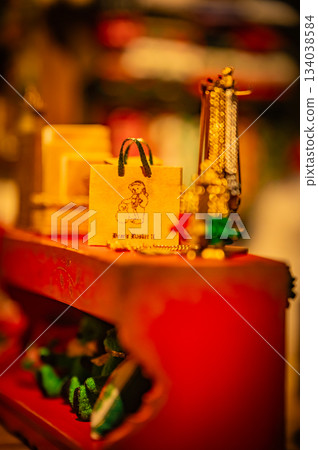 A warm scene with a teddy bear surrounded by Christmas goods 134038584