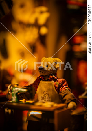 A warm scene with a teddy bear surrounded by Christmas goods A warm scene with a teddy bear surrounded by Christmas goods 134038633