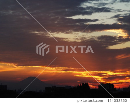 Clouds and silhouette of Mount Fuji illuminated by the setting sun Clouds and silhouette of Mount Fuji illuminated by the setting sun 134038860