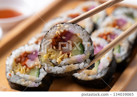Kimbap or Gimbap, Korean food, Cooked rice with vegetables, egg and wrapped with dried seaweed Kimbap or Gimbap, Korean food, Cooked rice with vegetables, egg and wrapped with dried seaweed 134039065