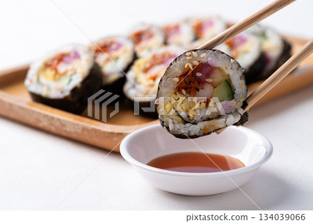 Kimbap or Gimbap, Korean food, Cooked rice with vegetables, egg and wrapped with dried seaweed Kimbap or Gimbap, Korean food, Cooked rice with vegetables, egg and wrapped with dried seaweed 134039066
