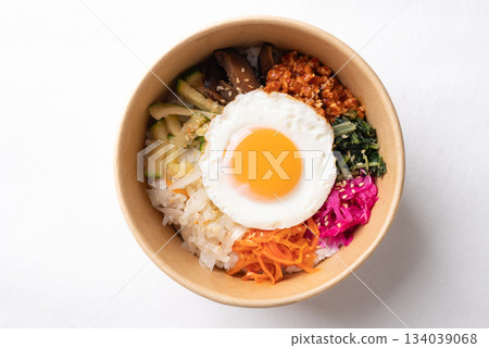 Bibimbap, Korean food, Cooked rice with vegetables, pork and egg in biodegrable bowl 134039068
