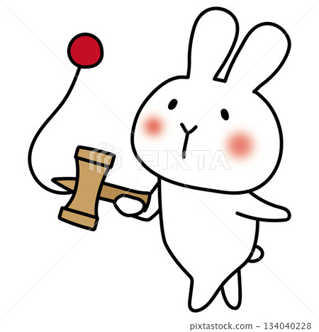 White rabbit playing with kendama 134040228