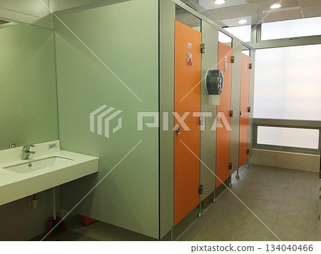 The interior of a public restroom with a sink 134040466