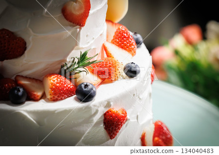 A picture of a big cream cake with lots of strawberries on top Wedding cake A picture of a big cream cake with lots of strawberries on top Wedding cake 134040483