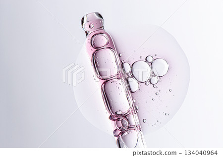 Skin serum in a pipette. A cosmetic product for body care. White background. 134040964