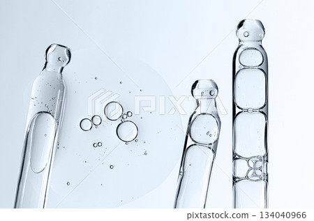 Skin serum in a pipette. A cosmetic product for body care. White background. 134040966