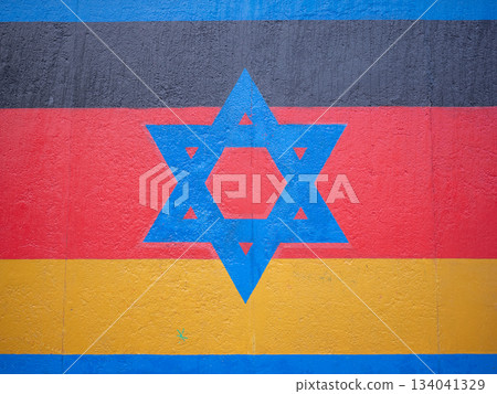 [Germany] The German flag and blue six-pointed star painted on the Berlin Wall 134041329