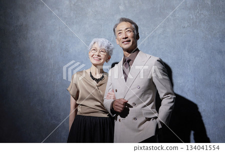 Portrait of a friendly senior couple on a black background 134041554