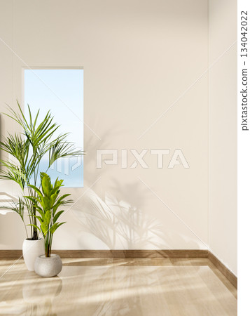 A square hole for sea viewing on white wall over potted plants at the end of wooden floor corridor. 134042022