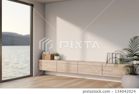 A glass door with sea view outside of a room with build in counter and potted plants on wooden floor A glass door with sea view outside of a room with build in counter and potted plants on wooden floor 134042024