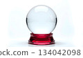 clear crystal sphere on red glass base isolated on white background. 134042098