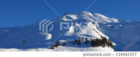 Ski area Stoos, chair lift going to Mount Klingenstock, Switzerland. Ski area Stoos, chair lift going to Mount Klingenstock, Switzerland. 134042337