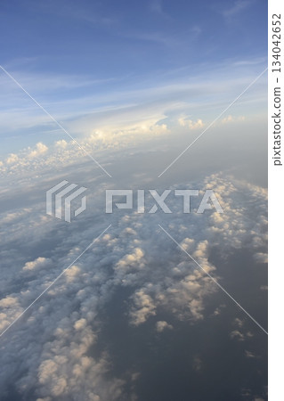 Evening sea of clouds after takeoff from Detroit Airport, USA 134042652