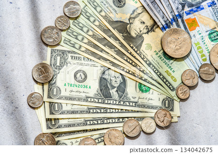Flat lay close-up of 20 and 1 dollar bills and US coins 134042675