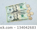 Flat lay 1 of 20 dollar bills and US coins 134042683