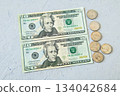 Flat lay 2 of 20 dollar bills and US coins 134042684
