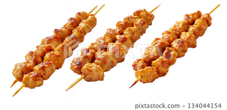 Grilled chicken Satay skewer with a golden brown glaze, isolated on white background, concept of tasty street food Grilled chicken Satay skewer with a golden brown glaze, isolated on white background, concept of tasty street food 134044154