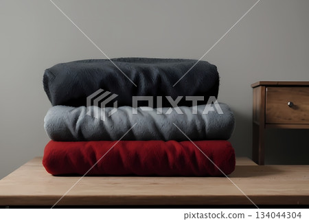 Red knitted yarn on the table 134044304